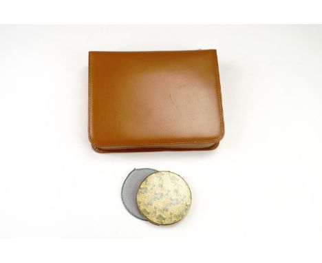 A mid 20th Century Connoisseur cow hide travel grooming kit, together with a powder compact