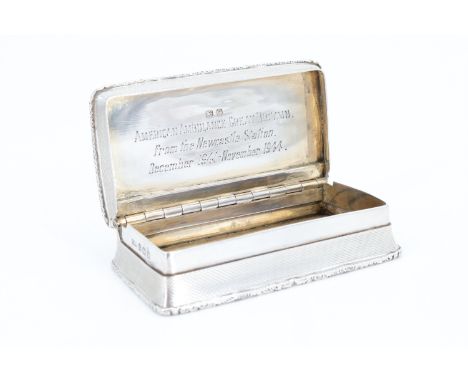 A George VI silver snuff box, being engine turned with cast borders and having an engraved dedication to the inside of the li