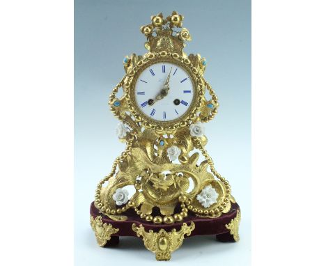 A 19th Century French gilt metal mantle clock, having a drum movement with a pendulum escapement striking on a later bell, th