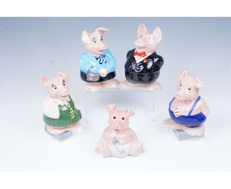 A set of Wade piggy banks with original " Nat West Bank" stoppers, tallest 19 cm