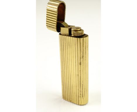 A vintage Cartier gold plated cigarette lighter 