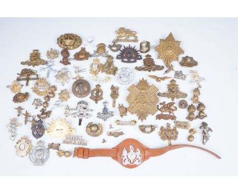 A quantity of British army cap badges, etc