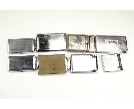 A group of vintage combination cigarette case and lighters, including three Mosda examples, one bearing a Cold War era map of