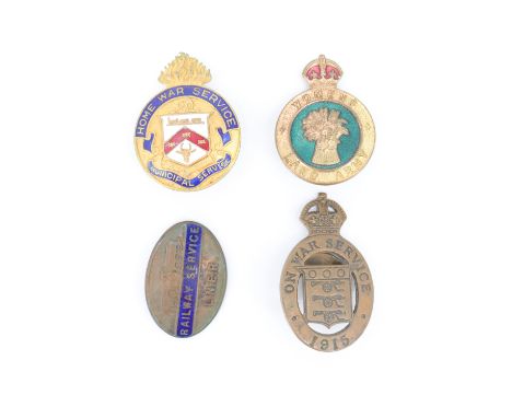A Great War "Home War Service, Municipal Service" enamelled lapel badge, a Women's Land Army cap badge, an LNER "Railway Serv