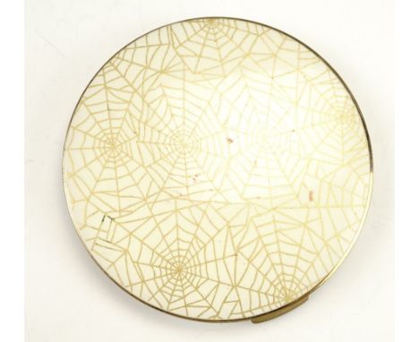 A vintage spider's web pattern powder compact, circa 1950s