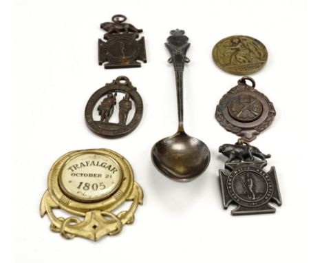 A Victorian rifle marksmanship prize spoon together with Army Rifle Association and similar fob medallions, and a Trafalgar c
