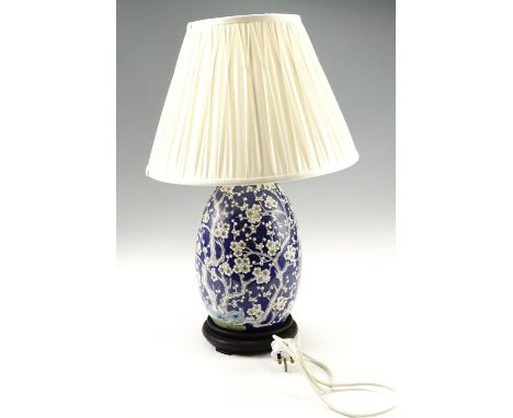 A Chinese oviform prunus pattern porcelain vase converted to a table lamp, 60 cm