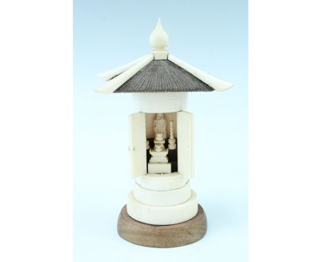 A Japanese carved bone domestic shrine, of architectural form, 20th Century, 17.5 cm (a/f) 