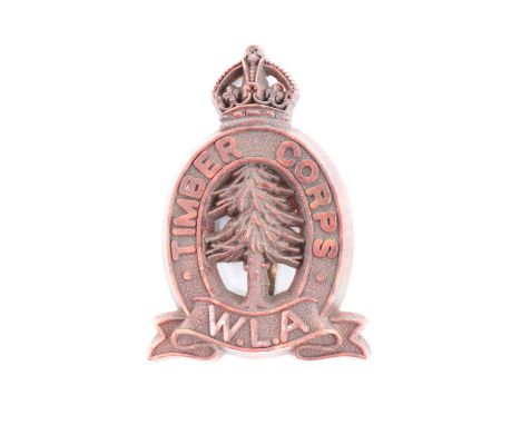 A Second World War Women's Land Army Timber Corps plastic cap badge