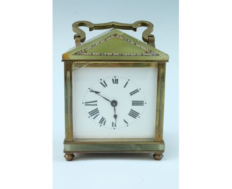 A mid 20th Century brass and onyx carriage clock, having a key wound movement with a white enamelled dial, (a/f), 9 x 6 x 12 