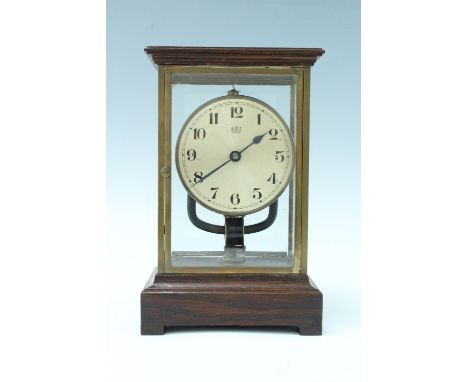 An early 20th Century Bulle electric clock, having an electromagnetic pendulum powered by a battery contained in the base, a 