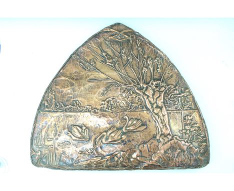 An Art Nouveau embossed arch shaped copper panel, depicting swans on a pond in the shade of a pollarded tree, with bulrushes 