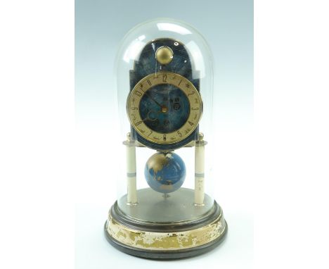 A late 20th Century Kaiser torsion clock, having a key wound movement, the pendulum modeled as a terrestrial globe, the dial 