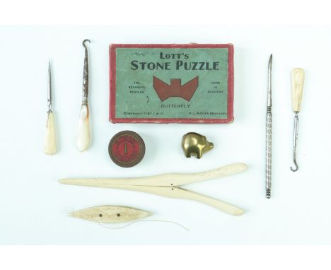 Victorian bone dressing table accessories including glove stretchers and button hooks, a thread bobbin, a puzzle, Kodak No. 1