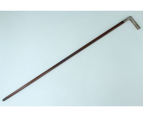 A fine late 19th / early 20th Century white metal mounted exotic hardwood walking stick, potentially exhibiting Art Deco infl