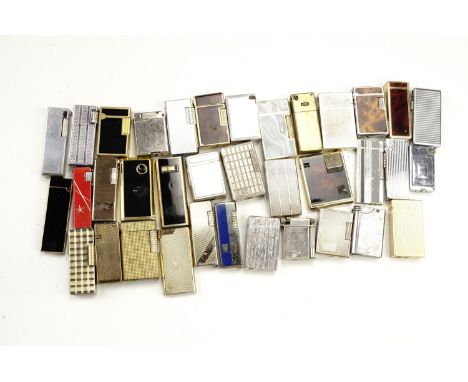 A quantity of vintage gas roller cigarette lighters, including Colibri, Win, Hadson etc