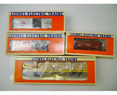 O GAUGE MODEL RAILWAYS: A group of four LIONEL wagons as lotted - VG in G boxes (4)