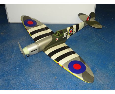 VINTAGE TOYS: A large scale hand built radio controlled Spitfire model - battery powered - circa 40" long - minor damage to p