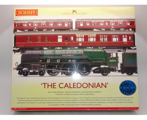 OO GAUGE MODEL RAILWAYS: A HORNBY R2306 'The Caledonian' Train Pack with 'King George VI' steam locomotive and 3 coaches - VG