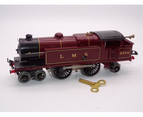 O GAUGE MODEL RAILWAYS: A HORNBY Series clockwork No. 2 LMS 4-4-2 tank locomotive numbered 6954 - some retouching and varnish