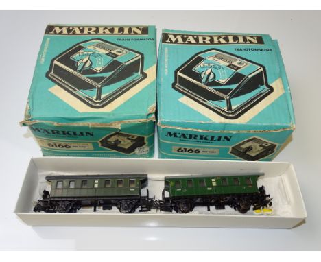 HO GAUGE MODEL RAILWAYS: A pair of vintage MARKLIN 6166 controllers together with 2 unboxed MARKLIN coaches - G in F/G boxes 