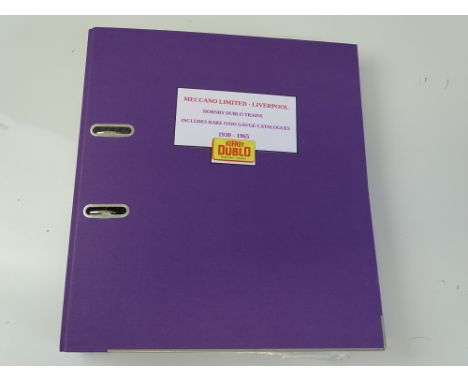 OO GAUGE MODEL RAILWAYS: A large lever arch file containing an archive of HORNBY DUBLO catalogues dating from 1930 to 1965 - 