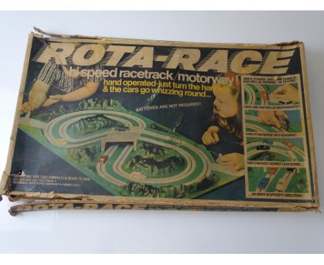 VINTAGE TOYS: A TRI-ANG Rota-Race motorway game - comprising hand operated layout and two TRI-ANG MINIX cars with pegs which 