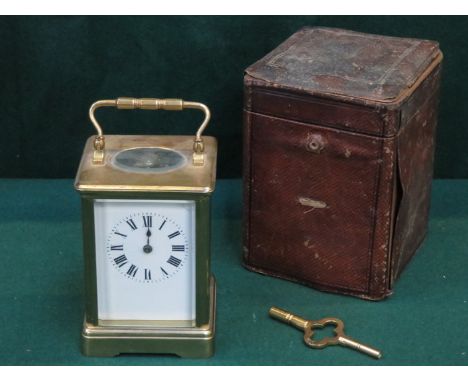 LEATHER CASED FRENCH STYLE BRASS AND GLASS CARRIAGE CLOCK 