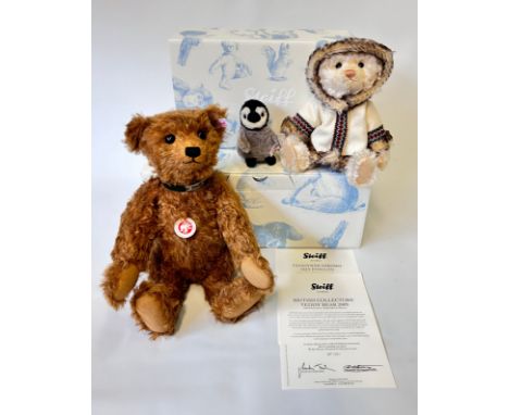 A limited edition Steiff Eskimo bear accompanied by a penguin, Dressed in a hooded coat with geometric pattern with fur trim 