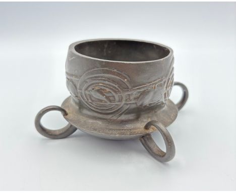 20th century moulded coaster, with ornate ring supports with stylized naturalistic motifs, attributed to Archibald Knox (1864