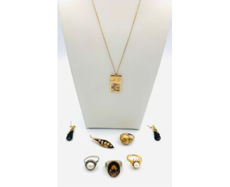 A group of jewellery, a ring watch by Watex, hinged cover, a 9ct gold St Christopher panel pendant and chain, a yellow metal 