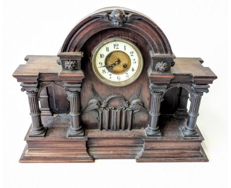 Victorian wooden clock with pillar and lion head design