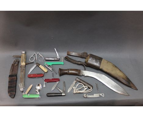 A Kukri knife with 12" blade with sheath, together with 11 pocket knives, fixed blade knives, to include makes IXL, Swiss Arm