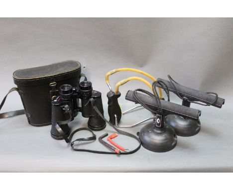 A pair of Vac Rack car fishing rod holders, a pair of Cosmica 8 x 40 binoculars, a pair of thigh waders size 9, a wading stic