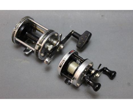 An Abu Garcia light cast bait casting reel, together with an Ambassador 7500C3.