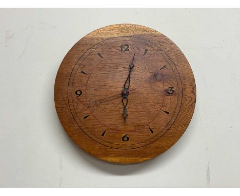 A contemporary light oak wall clock, diameter 31cm.