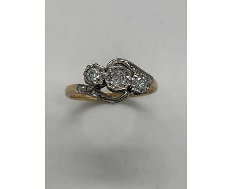 An 18ct yellow gold and platinum tipped three stone diamond ring, approx 0.80ct, size K, approx 2.8g.