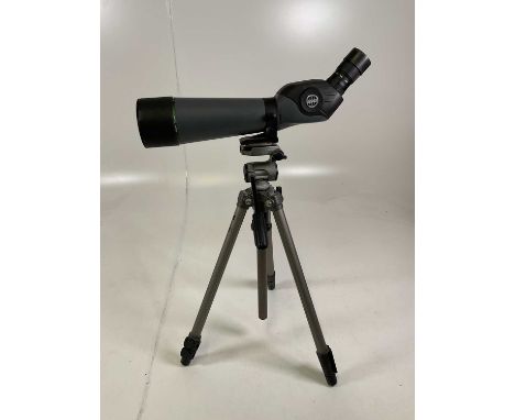 A Hawke sporting scope and tripod, height of tripod at full extension 146cm.