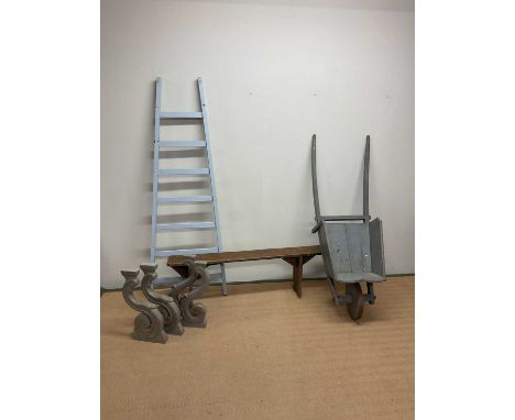 A collection of rustic wooden items including a French painted wheelbarrow, a painted French ladder, a rustic French bench an