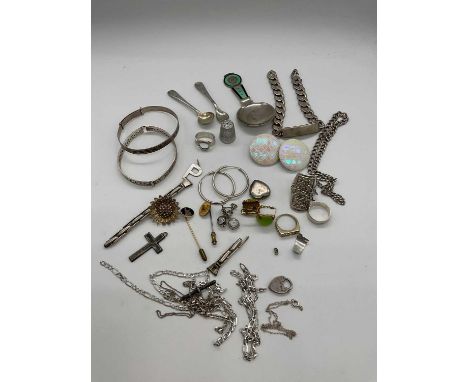 A group of silver and white metal, including an ID bracelet, chains, rings, an enamel caddy spoon (af) etc.