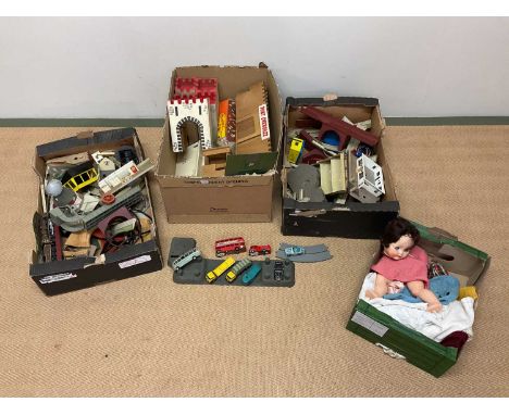 A collection of various vintage toys including a wooden fort and castle, Tri-ang Minic vehicles, track, buildings and an old 