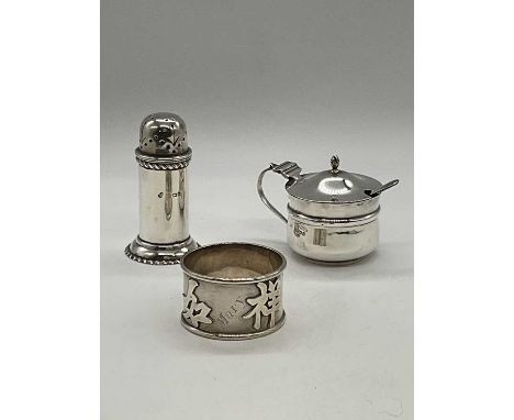 WANG HING; a Chinese silver napkin ring, 'Mary', a George V hallmarked silver mustard pot, Birmingham 1919, and a silver pepp