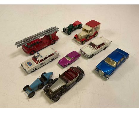 A collection of mixed toy cars including Matchbox Merryweather Fire Engine, Mercury police car, Bentley, 'Models of Yesteryea