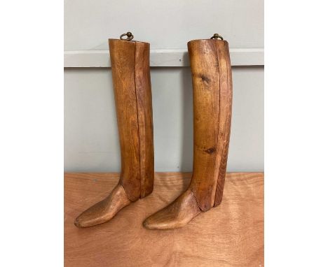 A pair of vintage wooden boot trees.