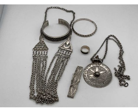 A small group of Omani silver jewellery including a circular pendant on chain, necklace, bangle, ring etc, combined approx 7o