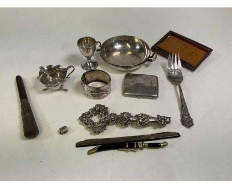 A quantity of silver and white metal including an 800 grade twin handled bowl and eggcup, parasol handle, sterling silver for