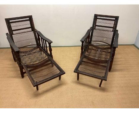 A pair of oak framed planter chairs, height 94cm.