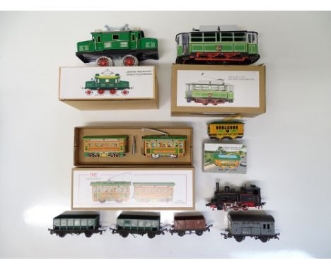 VINTAGE TOYS: A group of reproduction tinplate toys to include trams and locos of various scales, together with a small quant