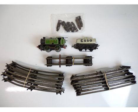 O SCALE MODEL RAILWAYS: A HORNBY Series clockwork tank locomotive in LNER livery and an ESSO tank wagon (both A/F) together w