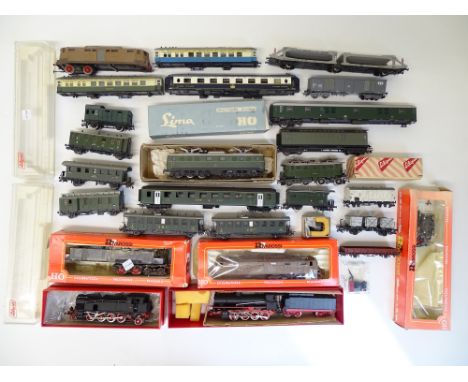 HO SCALE MODEL RAILWAYS: A large quantity of locos, coaches and wagons for spares or repair by RIVAROSSI, LIMA, LILIPUT etc -